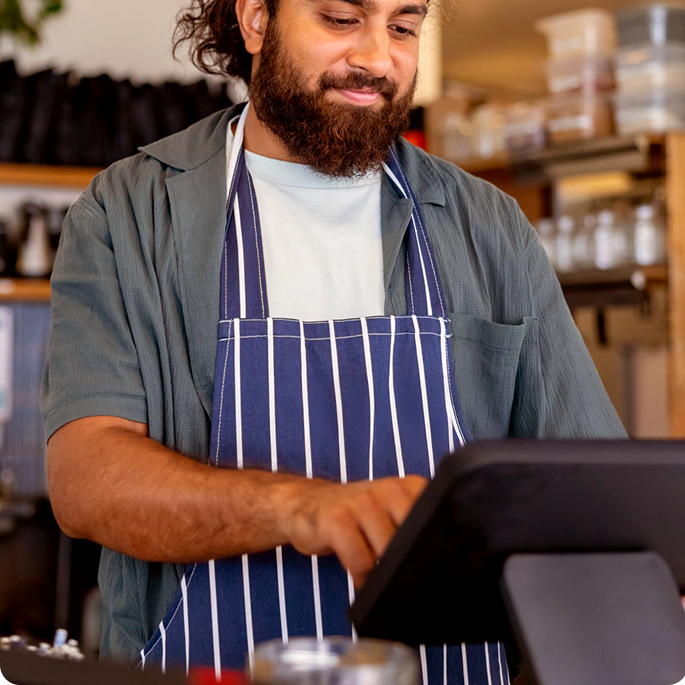 Chef using a Genius POS terminal